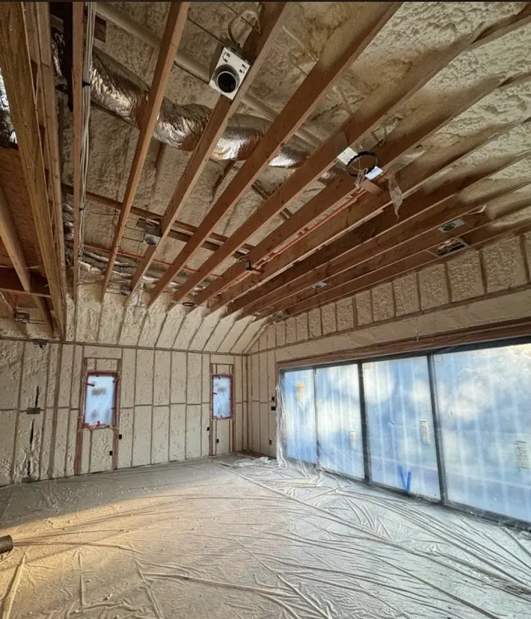 Interior walls and ceiling insulated with spray foam during new construction in Justin